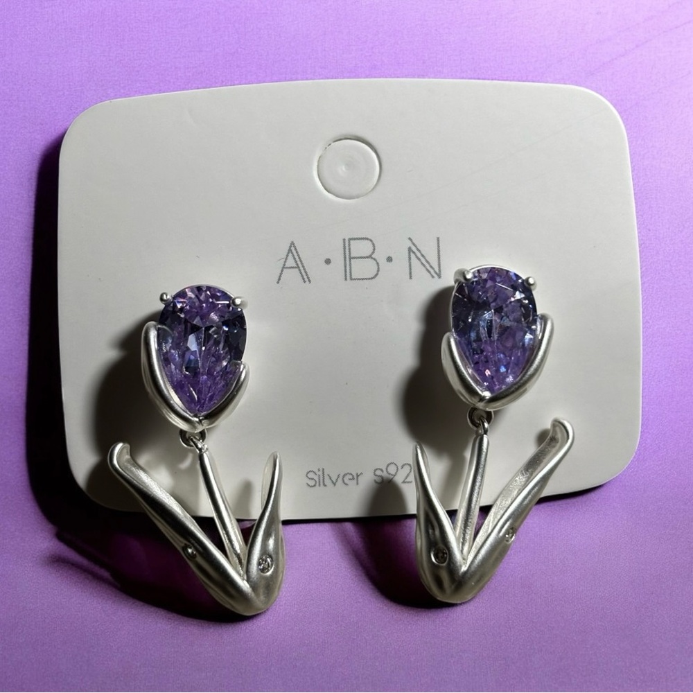 Silver tone purple rhinestone Tulip earrings. Brand new adorable.
